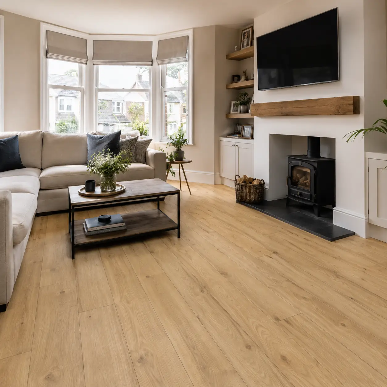 Light oak laminate flooring fitted in a bright Southport living room by Haven Carpets & Flooring.